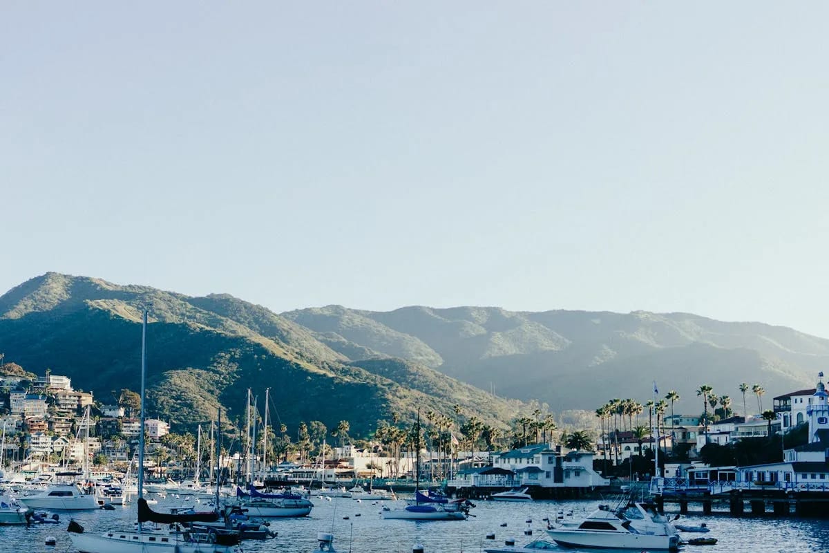 Port de Sóller bay with boats and Serra de Tramuntana mountains