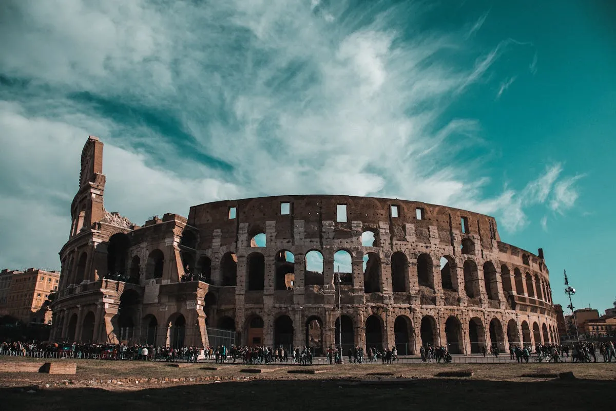 Interior view of the Colosseum in Rome showing arches and tiered seating