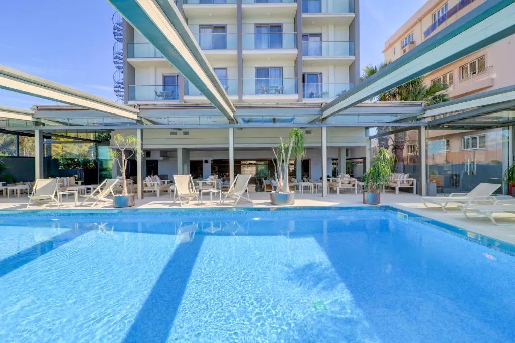 Palace Hotel Glyfada pool and garden with sea views