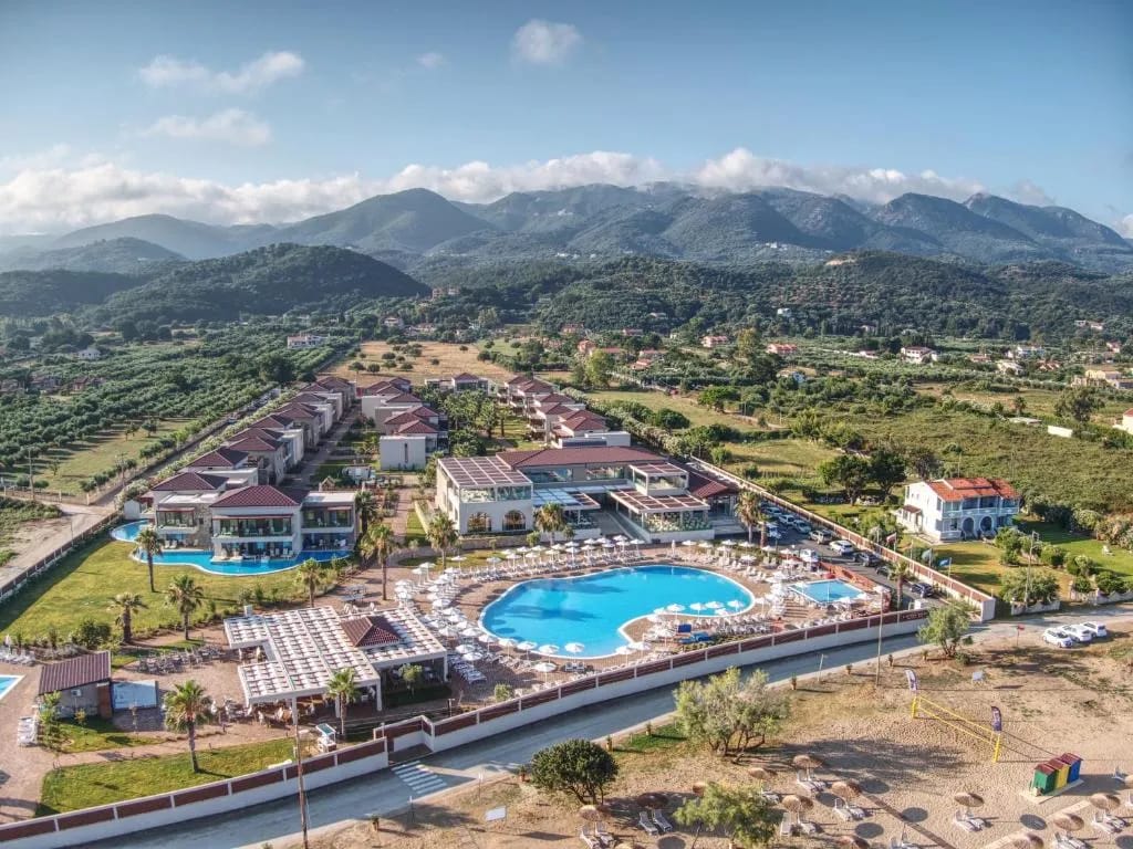 Almyros Beach Resort aerial view with pool and Ionian Sea, Corfu