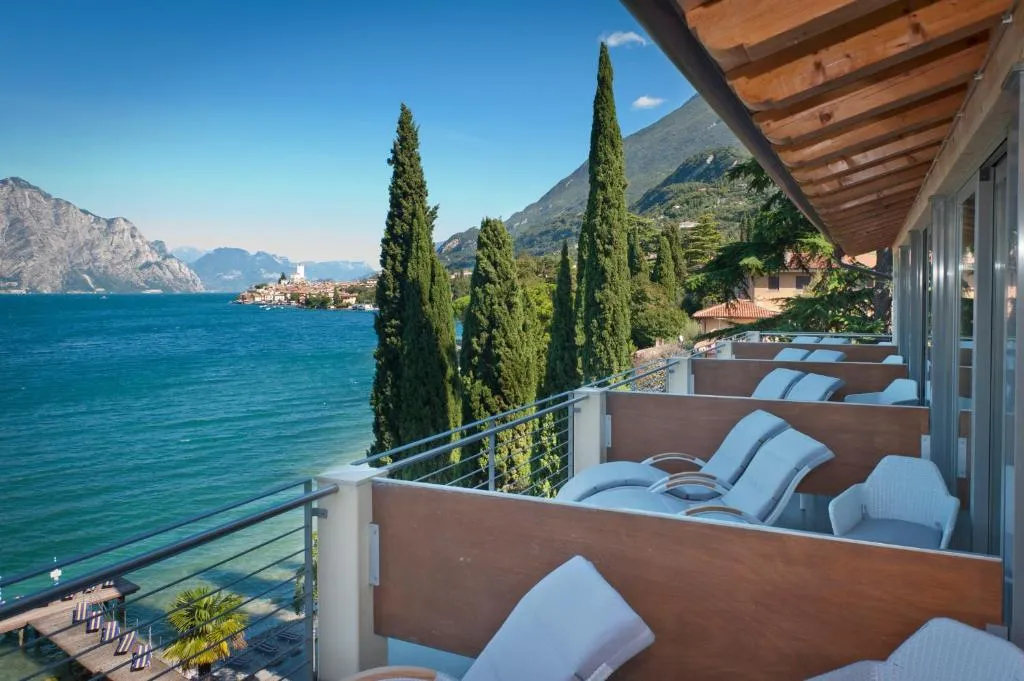 Lakefront private beach and sun terrace at Beach Hotel Du Lac Malcesine