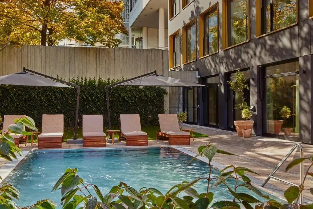 WunderLocke Munich exterior with outdoor pool