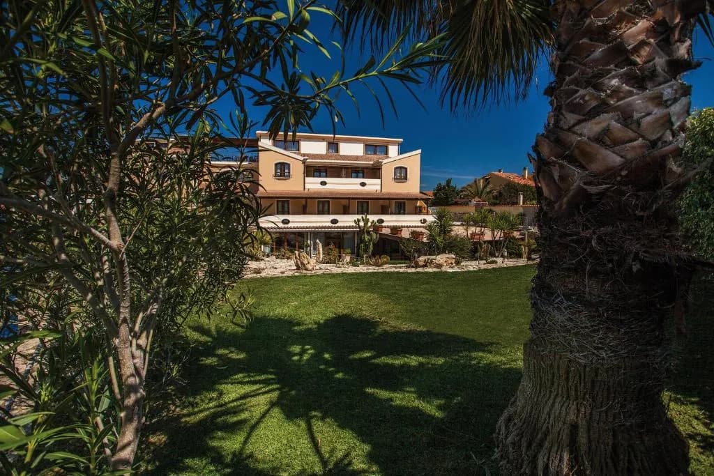 Hotel Raffael PHG exterior and garden in Putzu Idu, Sardinia